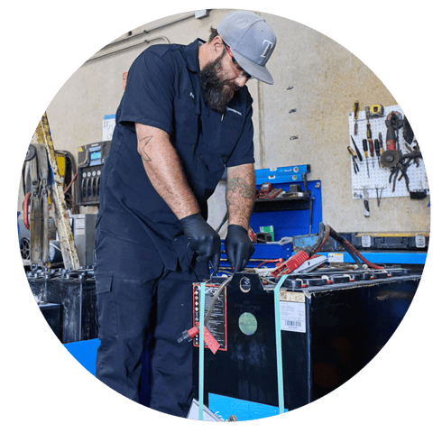 Concentric technician performing battery maintenance.